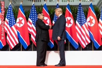 Kim-and-Trump-shaking-hands-red-carpet-during-DPRK-USA-Singapore-Summit